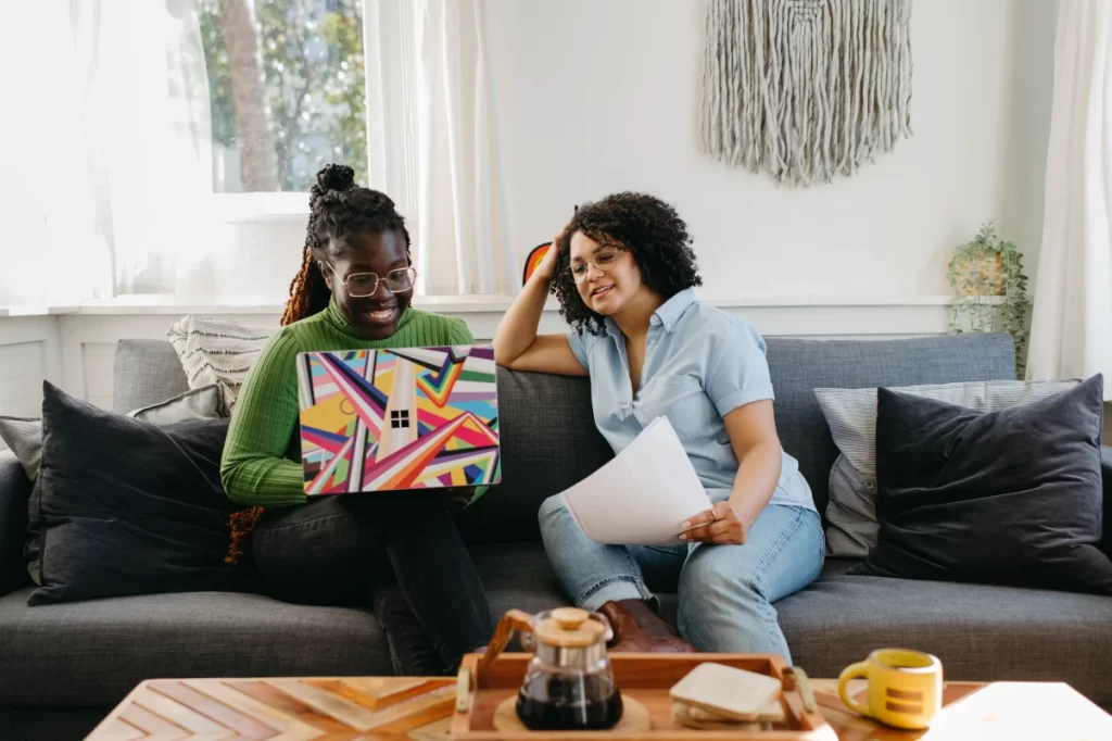 Coffee-table-two-ladies-laptop-paper-working