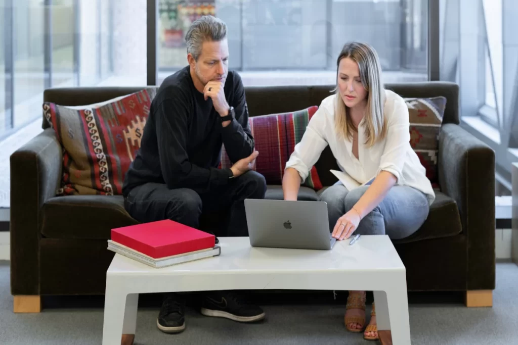 Coffee-table-two-people-laptop-books-working