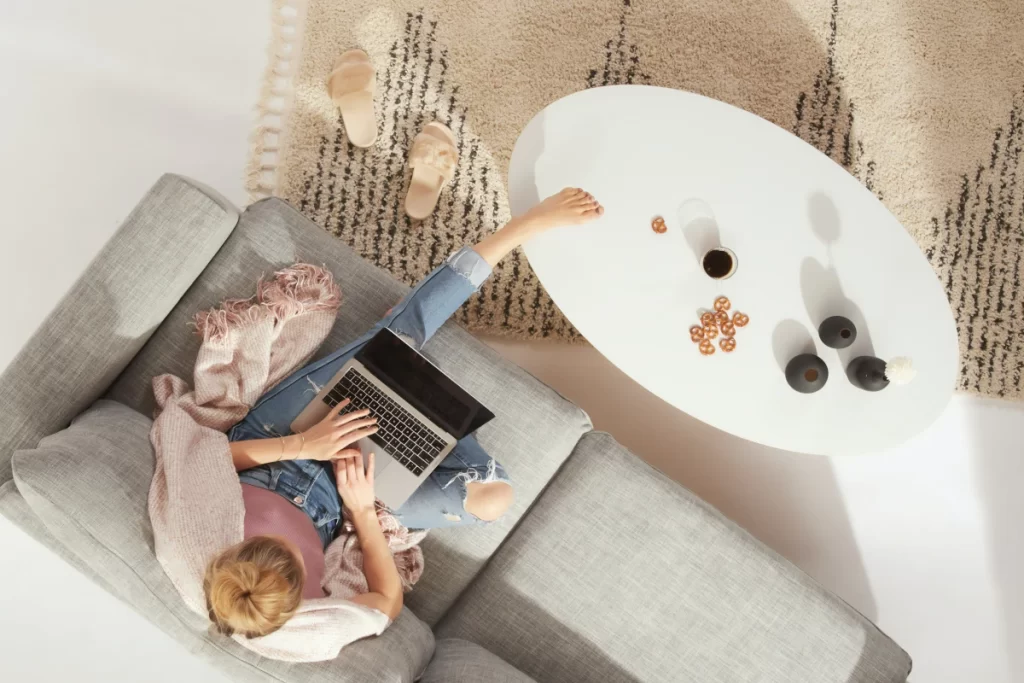 foot-without-shoes-coffee-table-woman-working