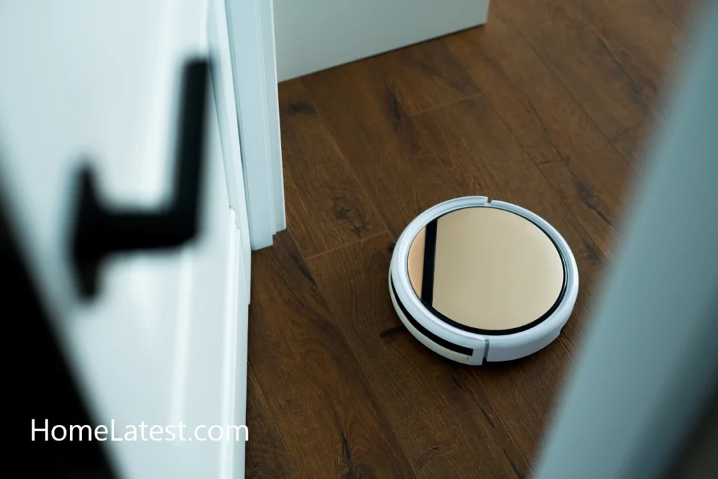 Circular robotic vacuum cleaner about to clean the corner